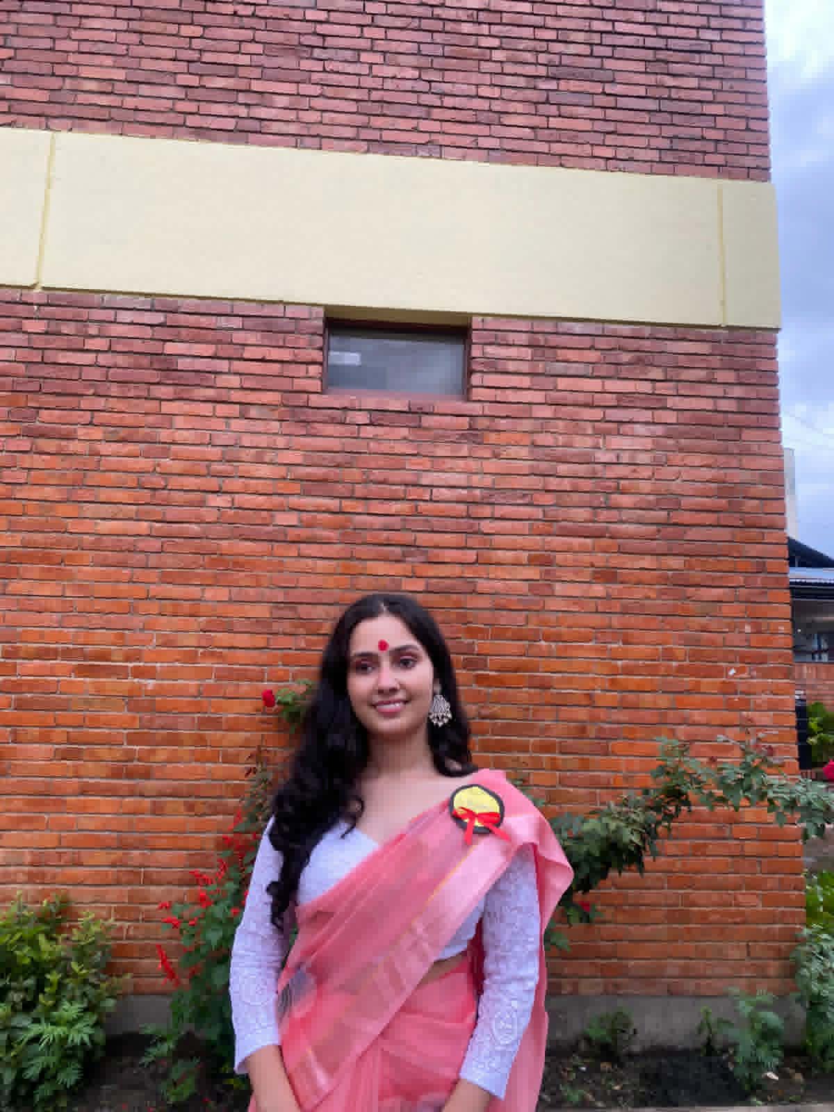 Rishma in a coral saree