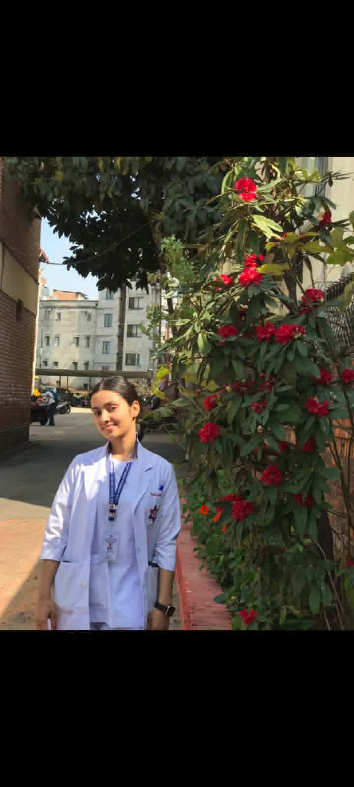 Rishma Pande in nursing coat outside Maharajgunj Nursing Campus
